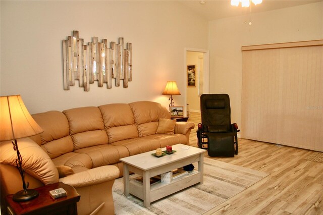 8735 SW 192nd Court Rd, Dunnellon, FL 34432 - living area with wood finished floors, ceiling fan, and high vaulted ceiling