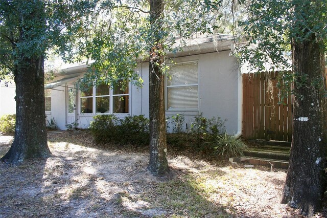 8735 SW 192nd Court Rd, Dunnellon, FL 34432 - view of property exterior with stucco siding