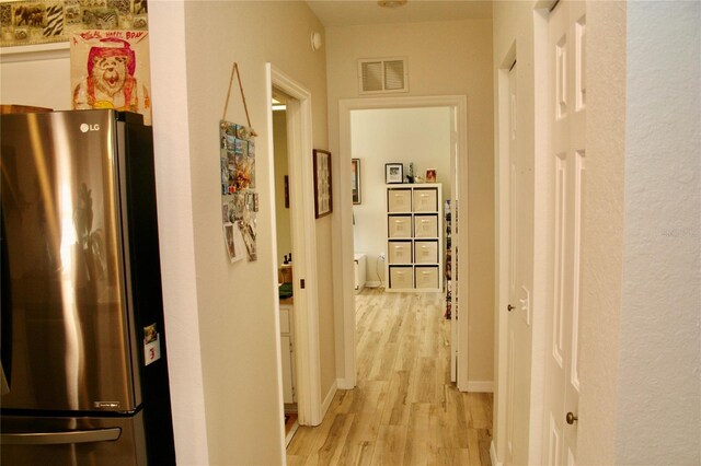 8735 SW 192nd Court Rd, Dunnellon, FL 34432 - hallway featuring light wood finished floors and baseboards