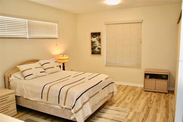 8735 SW 192nd Court Rd, Dunnellon, FL 34432 - bedroom with light wood-style flooring and baseboards