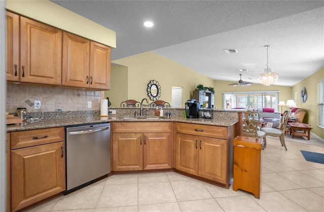 4692 N Lake Vista Trl, Hernando, FL 34442 - kitchen with dishwasher, a sink, a peninsula, brown cabinets, and decorative backsplash