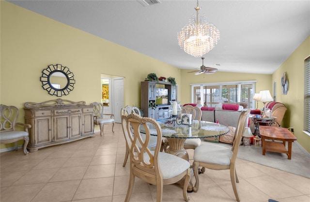 4692 N Lake Vista Trl, Hernando, FL 34442 - dining space featuring lofted ceiling, a chandelier, light tile patterned floors, a ceiling fan, and baseboards