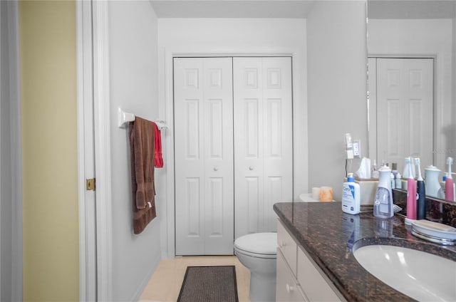 4692 N Lake Vista Trl, Hernando, FL 34442 - bathroom featuring a closet, vanity, toilet, tile patterned flooring, and baseboards