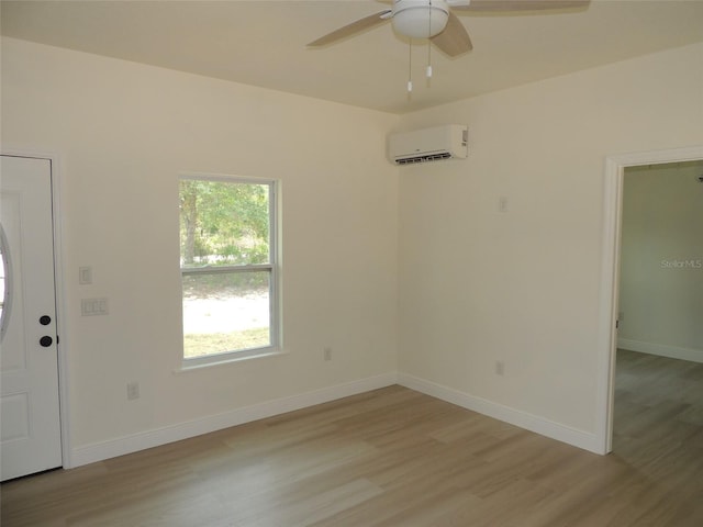 13391 NE 51st St, Williston, FL 32696 - foyer entrance with an AC wall unit, light wood-style flooring, a ceiling fan, and baseboards