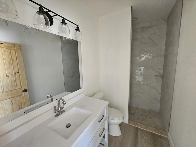 13391 NE 51st St, Williston, FL 32696 - bathroom with toilet, walk in shower, wood finished floors, vanity, and baseboards