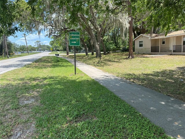 312 NW 28th St, Ocala, FL 34475 - view of home's community with a lawn