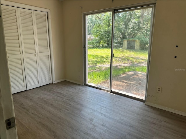 312 NW 28th St, Ocala, FL 34475 - unfurnished dining area featuring healthy amount of natural light, baseboards, and wood finished floors