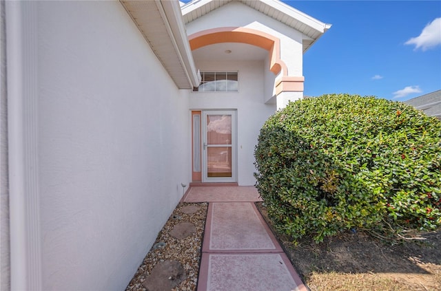 10444 S Clint Loop, Floral City, FL 34436 - property entrance featuring stucco siding