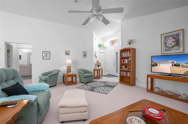 10444 S Clint Loop, Floral City, FL 34436 - carpeted living room with a ceiling fan and lofted ceiling