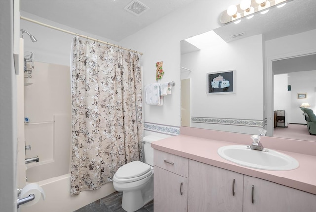 10444 S Clint Loop, Floral City, FL 34436 - bathroom featuring vanity, toilet, and shower / bath combo with shower curtain