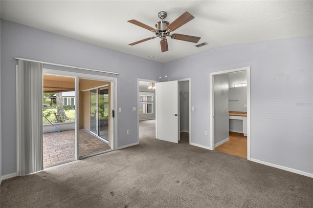 785 W Toucan Loop, Hernando, FL 34442 - unfurnished bedroom featuring carpet floors, baseboards, access to outside, ensuite bathroom, and vaulted ceiling