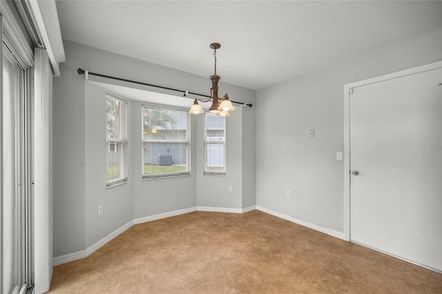 785 W Toucan Loop, Hernando, FL 34442 - unfurnished room featuring light colored carpet, a chandelier, and baseboards