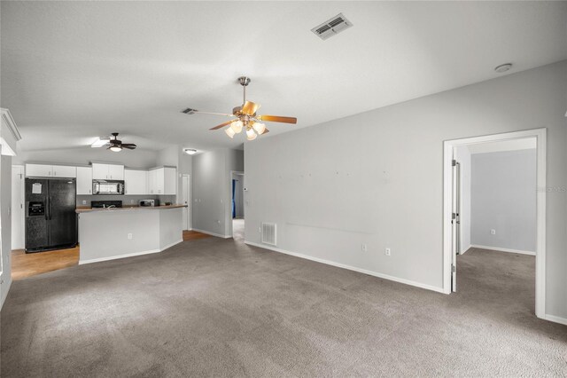 785 W Toucan Loop, Hernando, FL 34442 - unfurnished living room with a ceiling fan, carpet flooring, baseboards, and vaulted ceiling