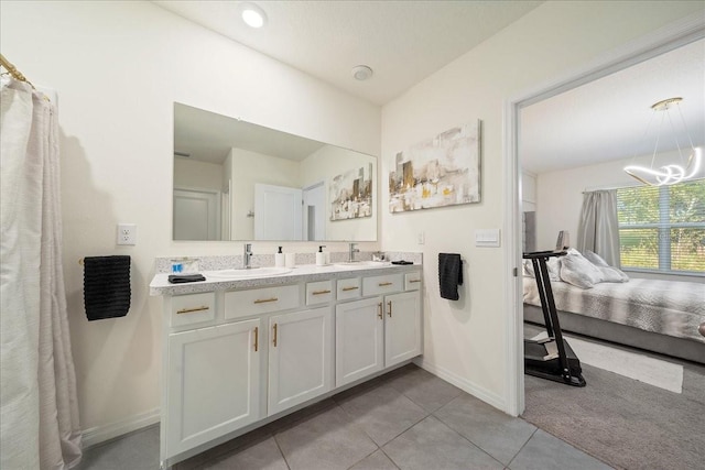 160 Hickory Course Loop, Ocala, FL 34472 - ensuite bathroom with double vanity, tile patterned flooring, and a chandelier
