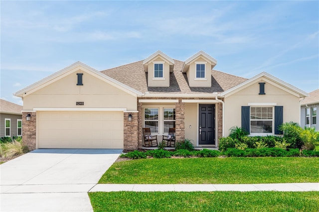 5248 Red Coral Cir, Mount Dora, FL 32757 - view of front of property with stucco siding, roof with shingles, a front lawn, driveway, and an attached garage