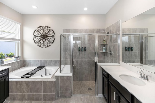 5248 Red Coral Cir, Mount Dora, FL 32757 - bathroom featuring vanity, a stall shower, and a garden tub