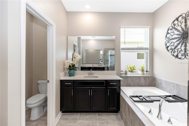 5248 Red Coral Cir, Mount Dora, FL 32757 - bathroom with a bath, toilet, vanity, and tile patterned floors
