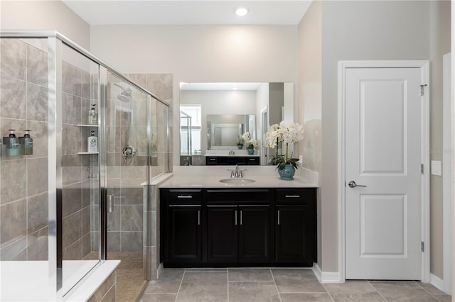 5248 Red Coral Cir, Mount Dora, FL 32757 - bathroom with a shower stall, vanity, tile patterned floors, and baseboards