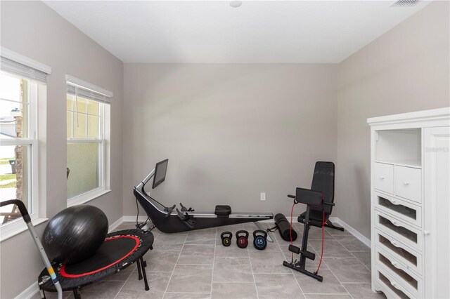 5248 Red Coral Cir, Mount Dora, FL 32757 - exercise area with baseboards and light tile patterned floors