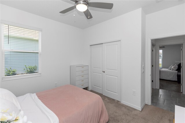 5248 Red Coral Cir, Mount Dora, FL 32757 - carpeted bedroom with a closet, baseboards, and ceiling fan