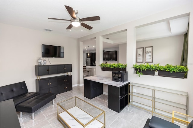 5248 Red Coral Cir, Mount Dora, FL 32757 - living area with a ceiling fan, light tile patterned floors, and baseboards