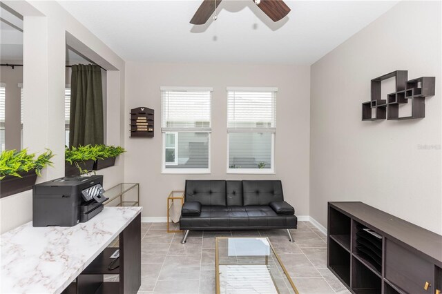 5248 Red Coral Cir, Mount Dora, FL 32757 - living area featuring ceiling fan, baseboards, and light tile patterned flooring