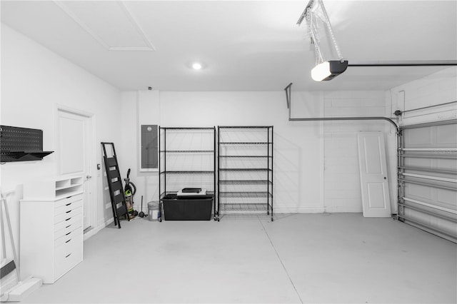 5248 Red Coral Cir, Mount Dora, FL 32757 - garage with electric panel, a garage door opener, and recessed lighting