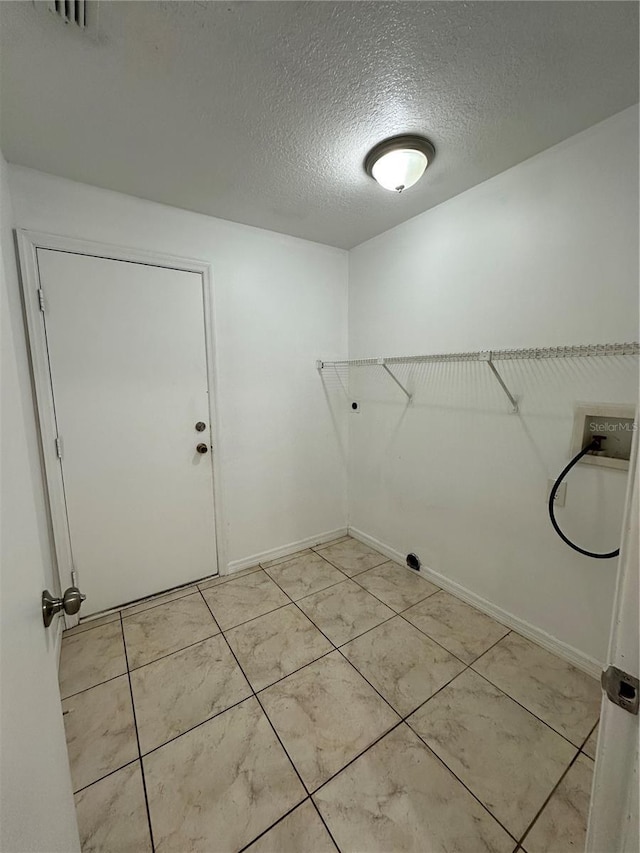 5525 SE 43rd Ct, Ocala, FL 34480 - laundry room featuring hookup for a washing machine and a textured ceiling