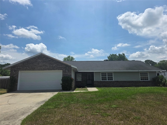 5525 SE 43rd Ct, Ocala, FL 34480 - ranch-style home with concrete driveway, a front lawn, a garage, and brick siding