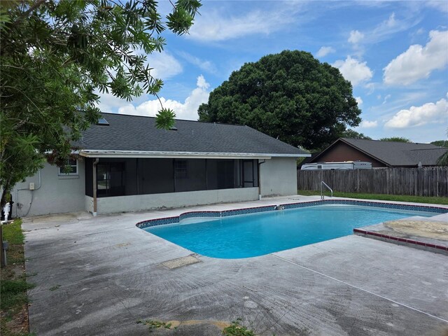 5525 SE 43rd Ct, Ocala, FL 34480 - view of swimming pool with a sunroom and a patio
