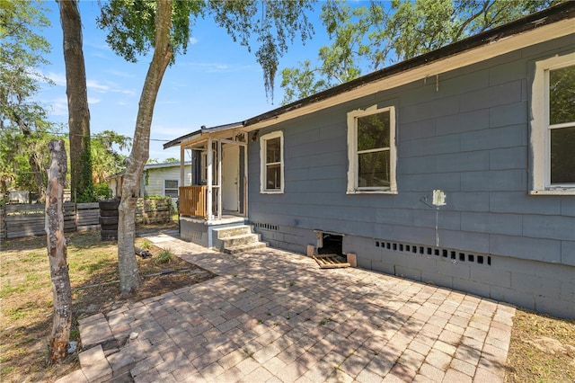 1014 NE 12th St, Ocala, FL 34470 - view of front facade with crawl space and a patio area