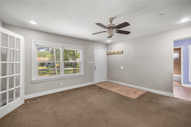 1014 NE 12th St, Ocala, FL 34470 - foyer entrance with carpet flooring, ceiling fan, baseboards, and recessed lighting