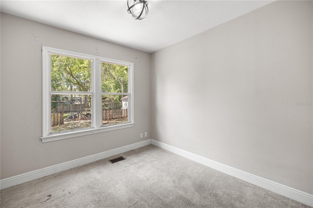 1014 NE 12th St, Ocala, FL 34470 - empty room with carpet and baseboards