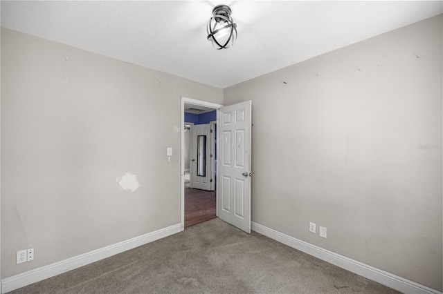 1014 NE 12th St, Ocala, FL 34470 - carpeted empty room with baseboards