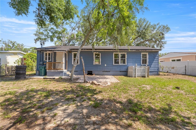 1014 NE 12th St, Ocala, FL 34470 - back of property with crawl space and a patio