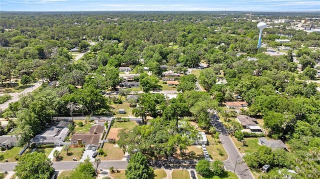 1014 NE 12th St, Ocala, FL 34470 - aerial overview of property's location with a heavily wooded area and nearby suburban area