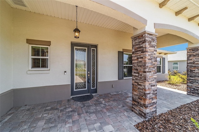 10451 SW 98th Place Rd, Ocala, FL 34481 - doorway to property featuring stucco siding