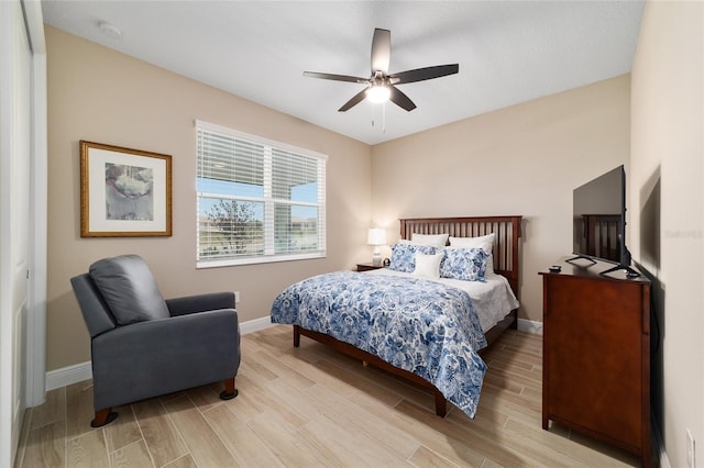 10451 SW 98th Place Rd, Ocala, FL 34481 - bedroom featuring light wood-style flooring, baseboards, and a ceiling fan