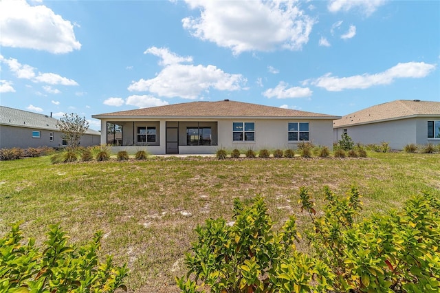 10451 SW 98th Place Rd, Ocala, FL 34481 - rear view of property featuring a yard and stucco siding