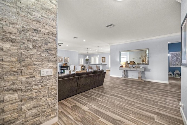 1107 SE 49th Ave, Ocala, FL 34471 - living room featuring ornamental molding, baseboards, wood finished floors, recessed lighting, and a textured ceiling