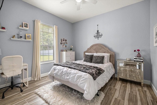 1107 SE 49th Ave, Ocala, FL 34471 - bedroom featuring wood tiled floors, baseboards, and a ceiling fan