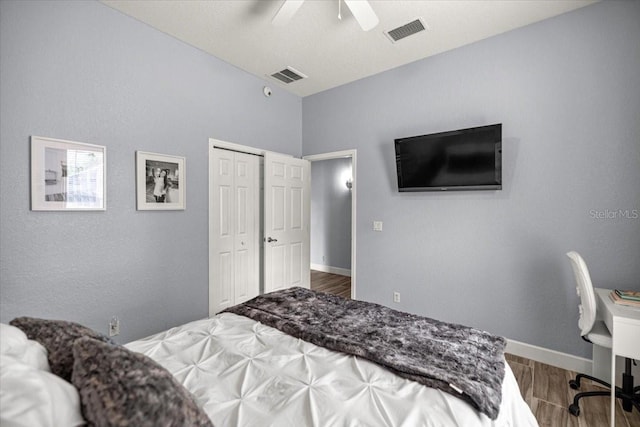1107 SE 49th Ave, Ocala, FL 34471 - bedroom featuring wood finished floors, a closet, a ceiling fan, and baseboards