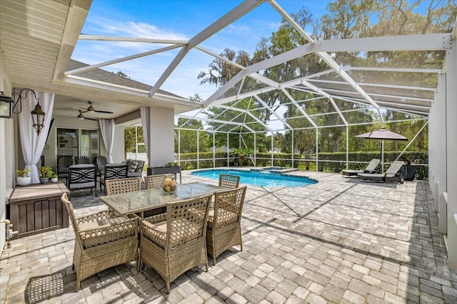 1107 SE 49th Ave, Ocala, FL 34471 - view of pool with a patio area, ceiling fan, outdoor dining space, a pool with connected hot tub, and glass enclosure