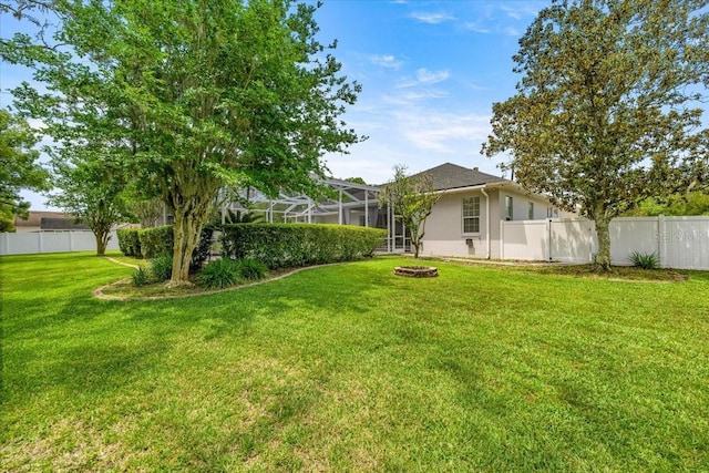 1107 SE 49th Ave, Ocala, FL 34471 - view of yard with glass enclosure and a fire pit
