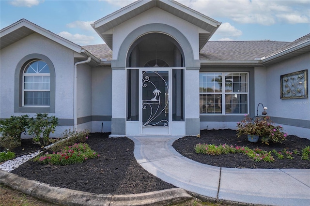3656 E Lake Todd Dr, Hernando, FL 34442 - entrance to property featuring roof with shingles and stucco siding