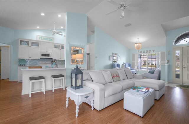 3656 E Lake Todd Dr, Hernando, FL 34442 - living room with a ceiling fan, high vaulted ceiling, and wood finished floors