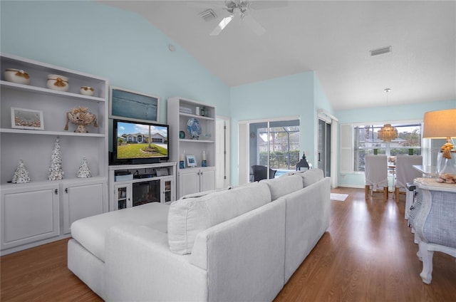 3656 E Lake Todd Dr, Hernando, FL 34442 - living room with wood finished floors, ceiling fan, and high vaulted ceiling
