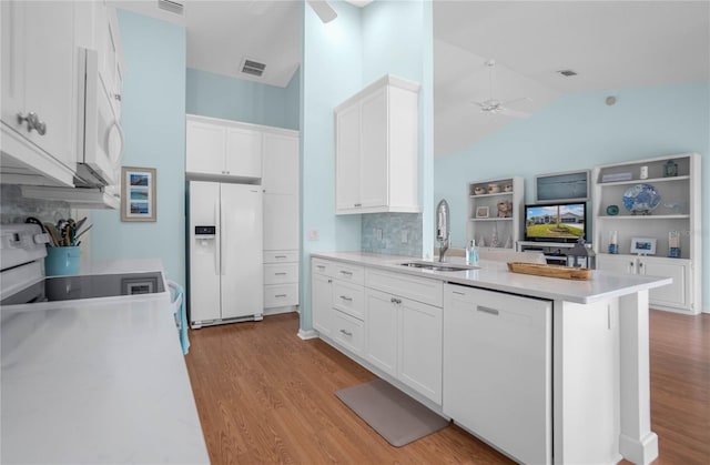 3656 E Lake Todd Dr, Hernando, FL 34442 - kitchen featuring white appliances, a sink, ceiling fan, light wood-style floors, and decorative backsplash