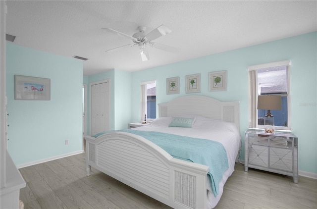 3656 E Lake Todd Dr, Hernando, FL 34442 - bedroom with wood finished floors, a closet, baseboards, and ceiling fan