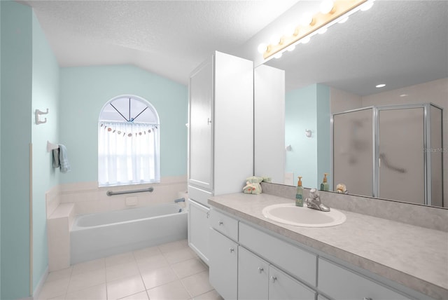3656 E Lake Todd Dr, Hernando, FL 34442 - full bathroom featuring vanity, a textured ceiling, tile patterned floors, a garden tub, and a stall shower
